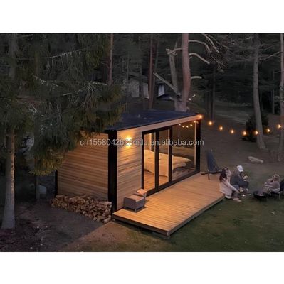 Entrepôt métallique en bois miniature personnalisé Conteneur modernement évolutif Maison préfabriquée pour panneau de sandwich en acier extérieur